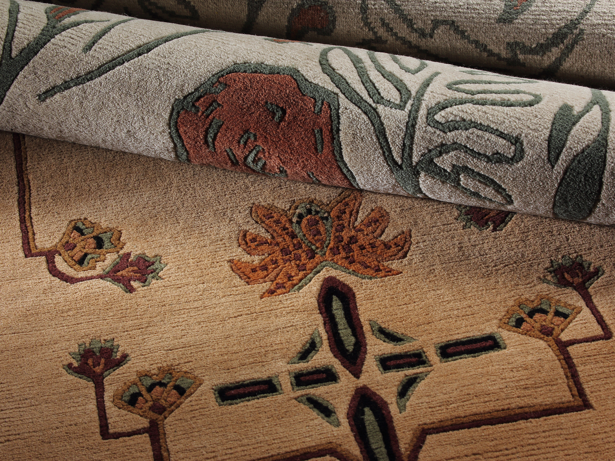 Stickley Designer Rugs — handcrafted area rug featuring a large-scale floral dahlia pattern in soft rose, cream, and olive green tones.