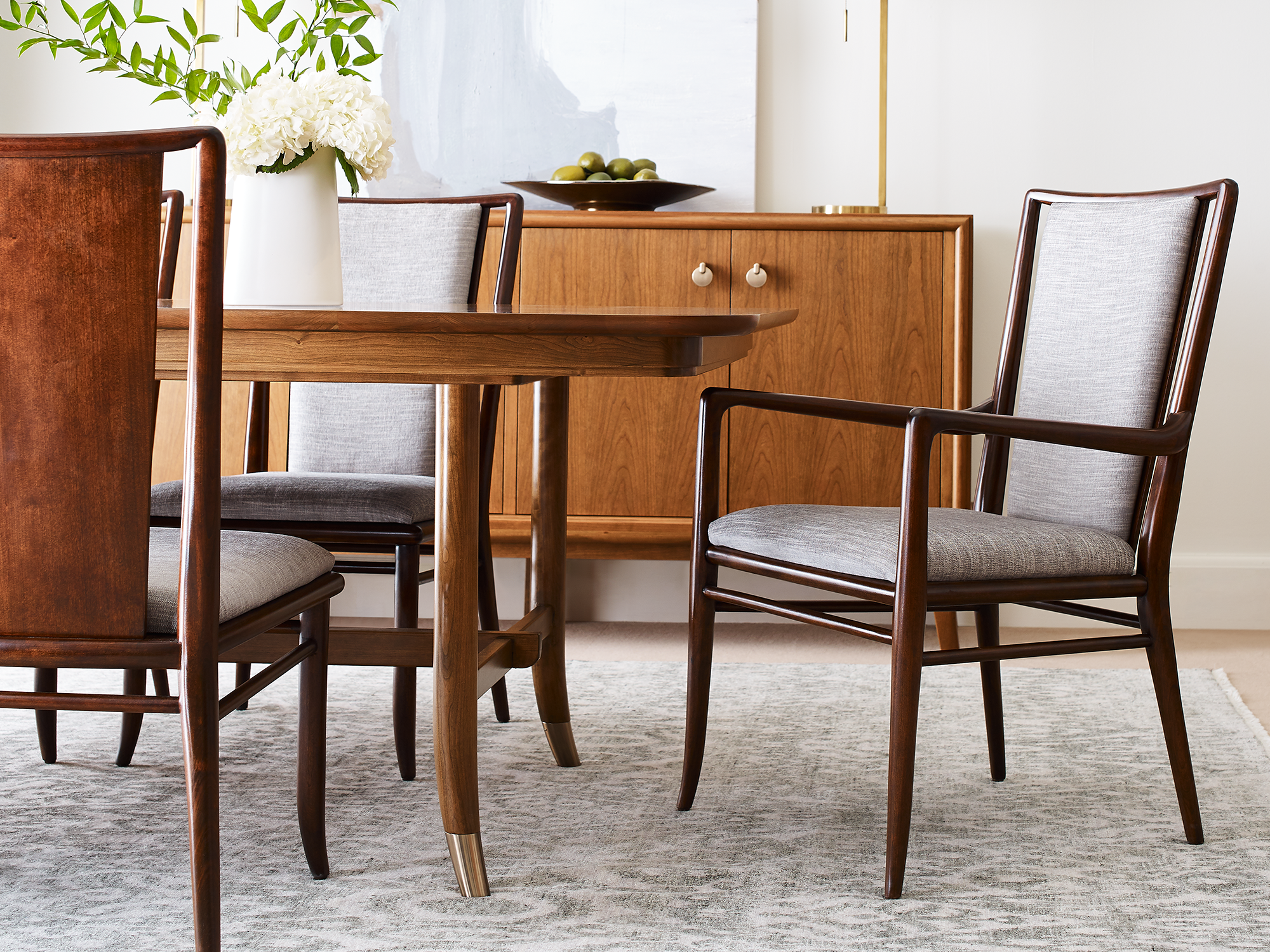 Stickley Martine Collection — modern cherry wood dining set featuring a rectangular dining table and upholstered chairs in a bright, contemporary dining room.