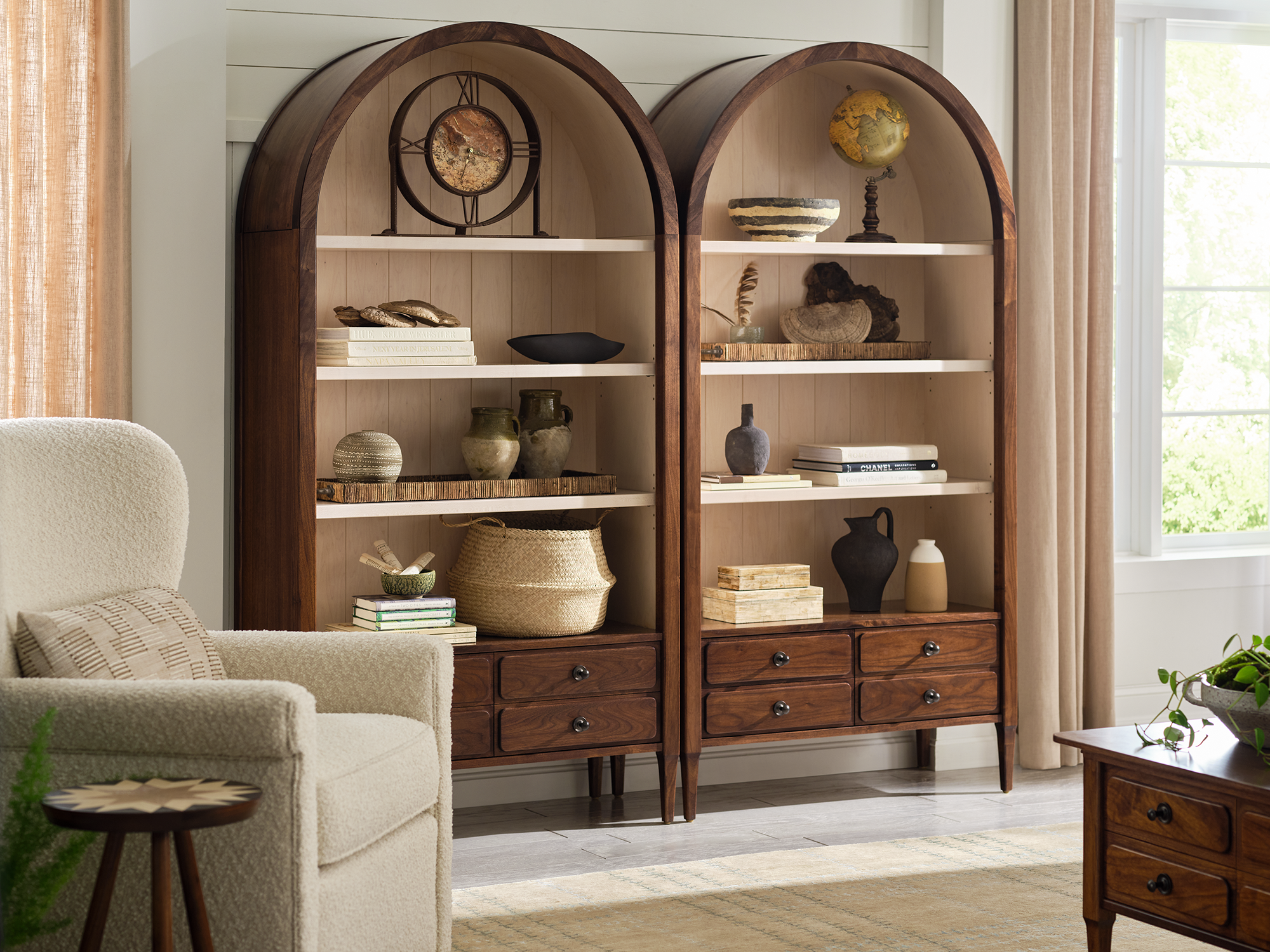 Stickley Hudson Valley Collection — solid wood bookcase with open shelving and lower storage cabinets in a light-filled home office setting.