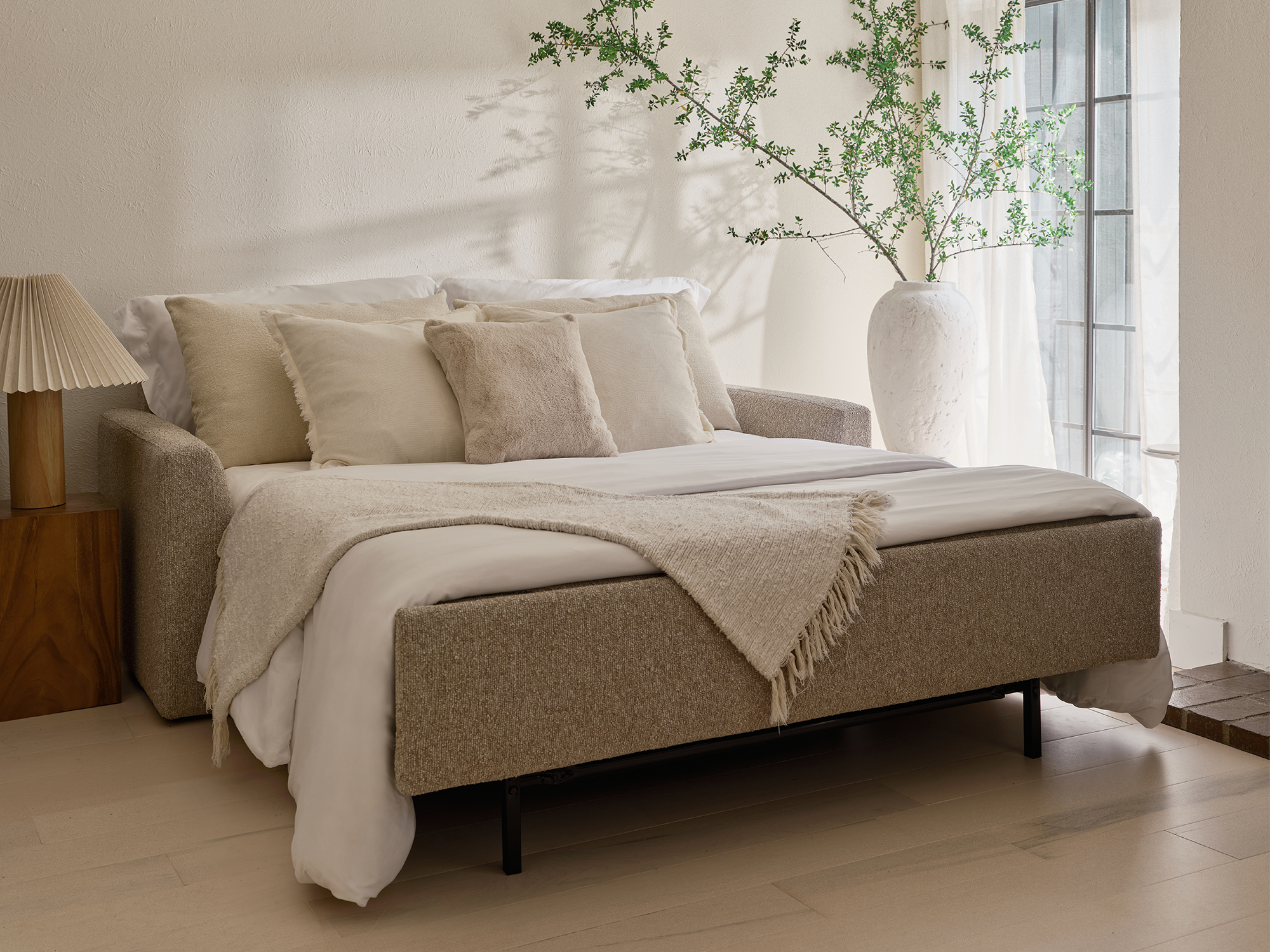 American Leather Clara — modern track arm sleeper sofa in Quinn Pebble recycled bouclé. Features soft-curve interior padding and the patented Tiffany 24/7™ platform sleep system for premium comfort and high-performance sustainability.