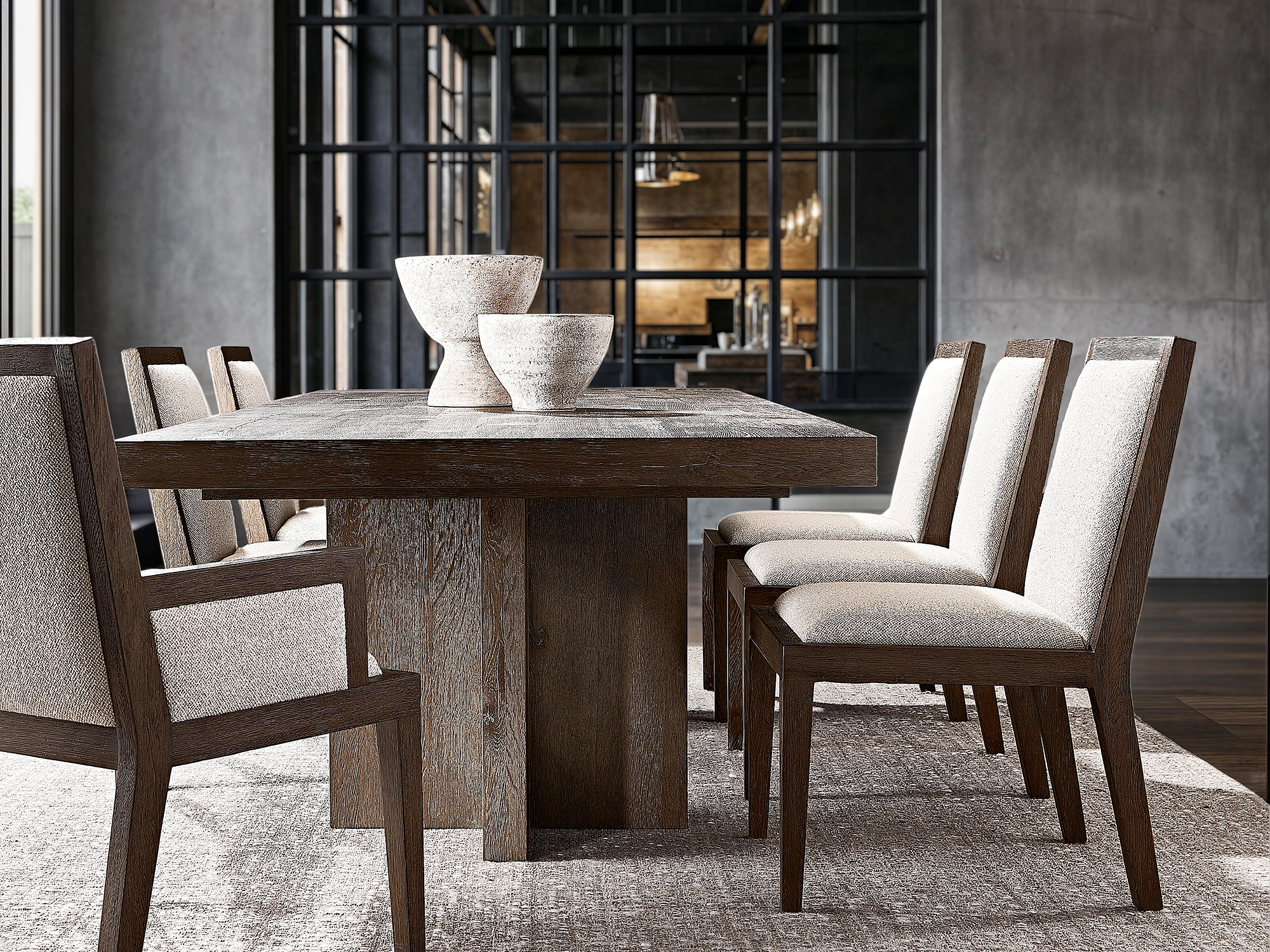 Bernhardt Outline — High-fashion dining room featuring a sleek architectural dining table, sculptural armchairs, and a linear-textured sideboard. Includes a bold sunburst mirror against a minimalist concrete backdrop for a modern, high-end aesthetic.