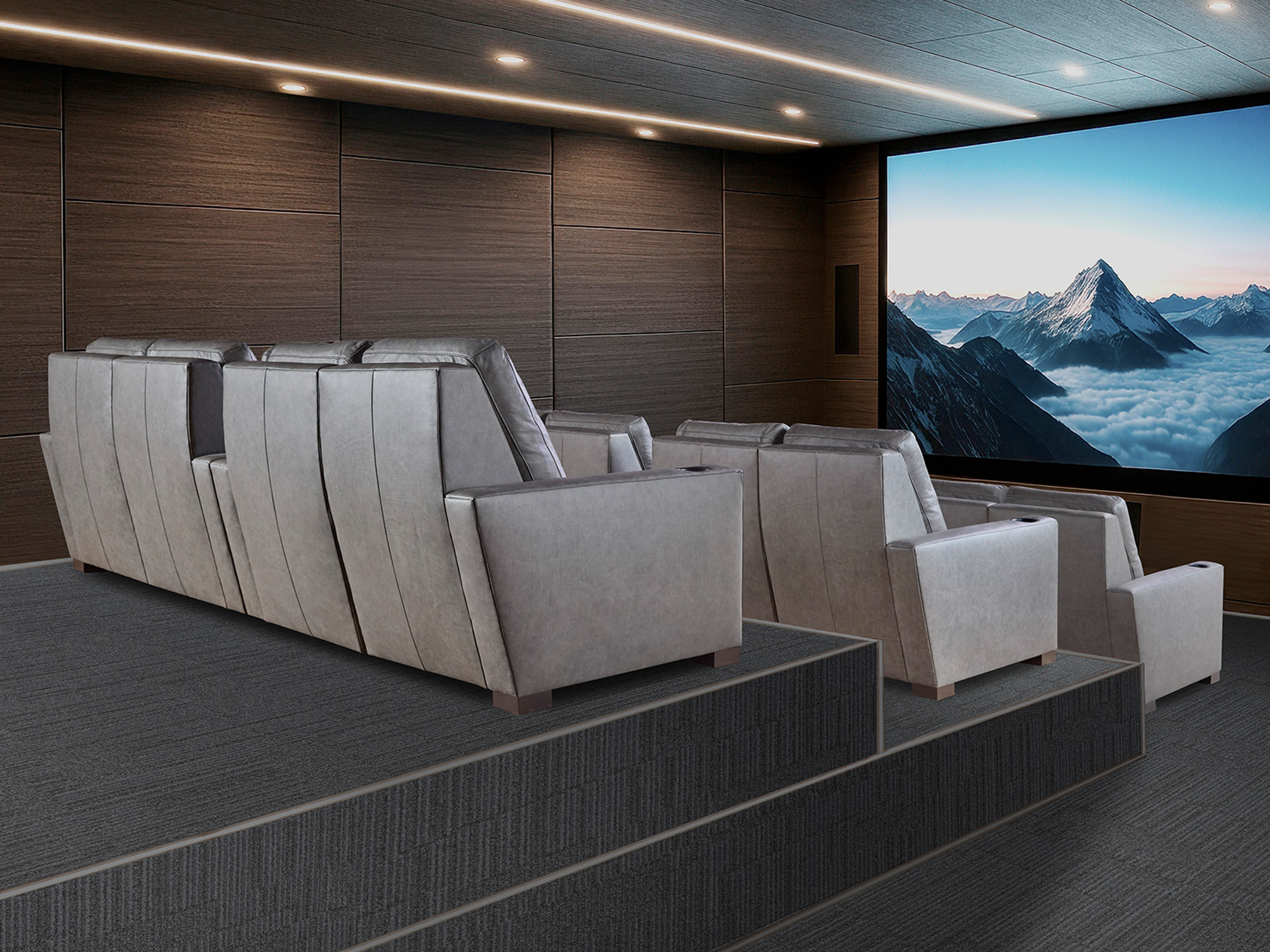 Hancock & Moore Theater Your Way — sleek modern home cinema featuring tiered rows of slate-gray leather power-recliners, integrated cup holders, and a minimalist wood-paneled viewing environment.